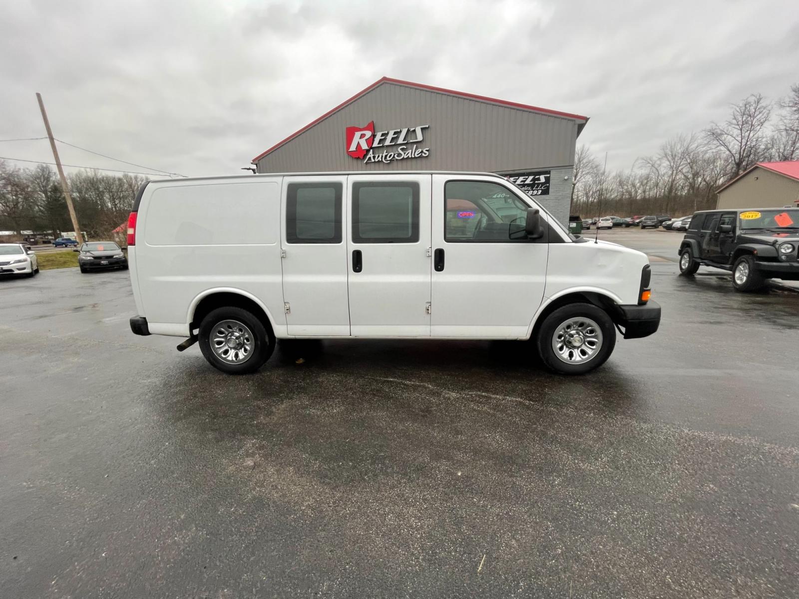 2014 White /Neutral Chevrolet Express 1500 AWD Cargo (1GCSHAF4XE1) with an 5.3L V8 OHV 16V FFV engine, 4-Speed Automatic transmission, located at 547 E. Main St., Orwell, OH, 44076, (440) 437-5893, 41.535435, -80.847855 - This 2014 Chevrolet Express 1500 Cargo Van with a 5.3L Vortec V8 engine and all-wheel drive is a versatile and robust vehicle designed to meet various transportation and towing needs. It comes equipped with convenient features such as power windows, power locks, and a backup camera for safer reversi - Photo #5